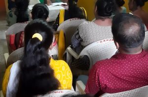 Parents are interacting with Head Mistress and Section Head